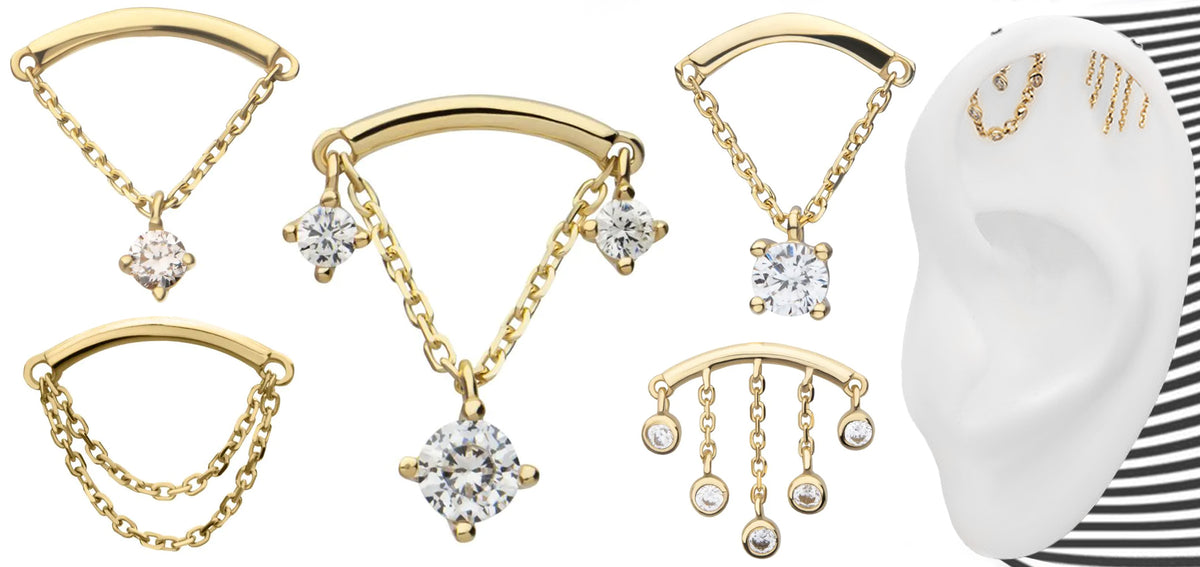 Gold-tone hidden helix pieces with draped chains and clear crystal dangles, beside an ear model showing them worn