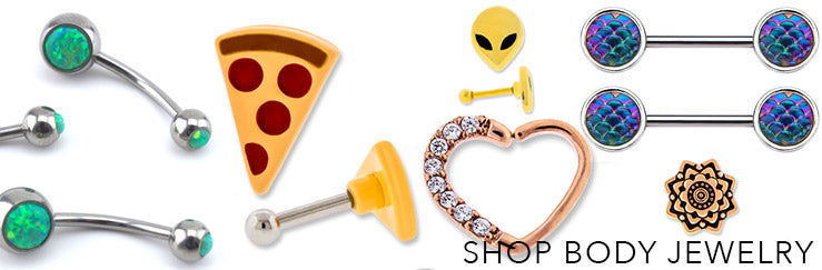Curved barbells, pizza and alien studs, a crystal heart hoop and scale barbells, labeled Shop Body Jewelry