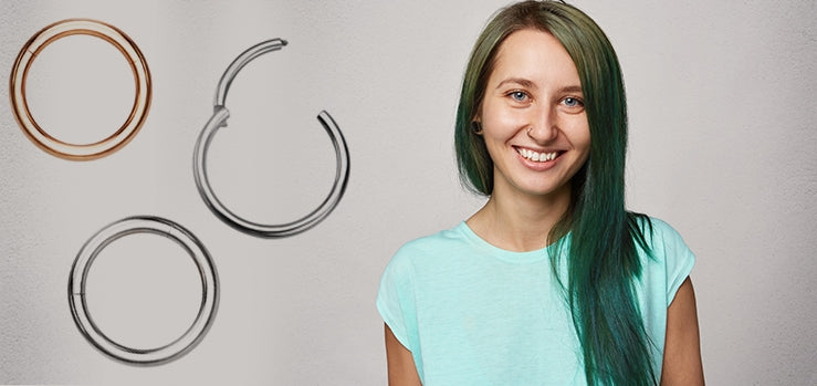 Smiling woman with long green hair and a small black plug in her lobe, beside rose gold, silver-tone and dark hinged hoops