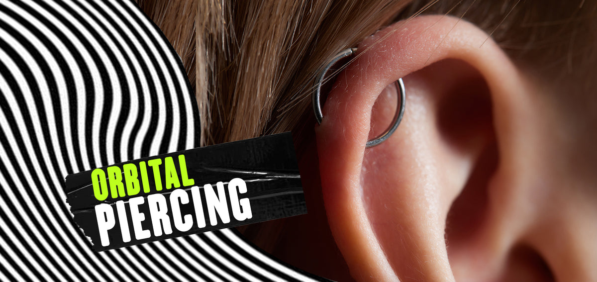 Text reading Orbital Piercing beside an ear with a silver-tone hoop passing through two holes in the upper helix
