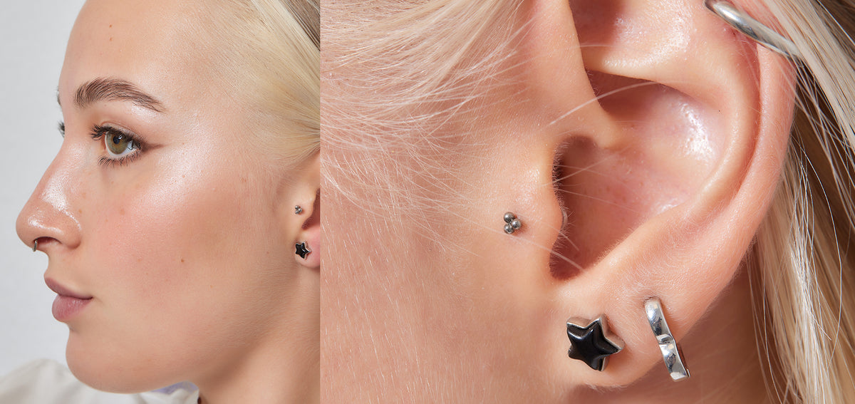 Blond woman in profile beside a close-up of her ear, with a tragus stud, a black star lobe stud and a huggie