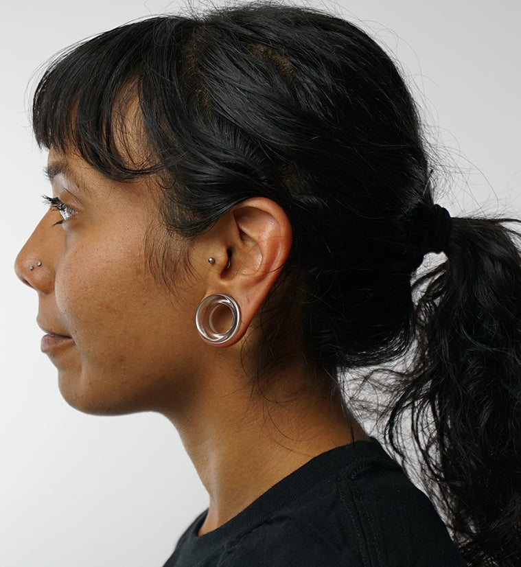 Clear Glass Tunnel Plugs, worn in a stretched earlobe, side profile
